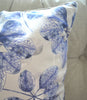 Blue botanical floral fabric cushion closeup 